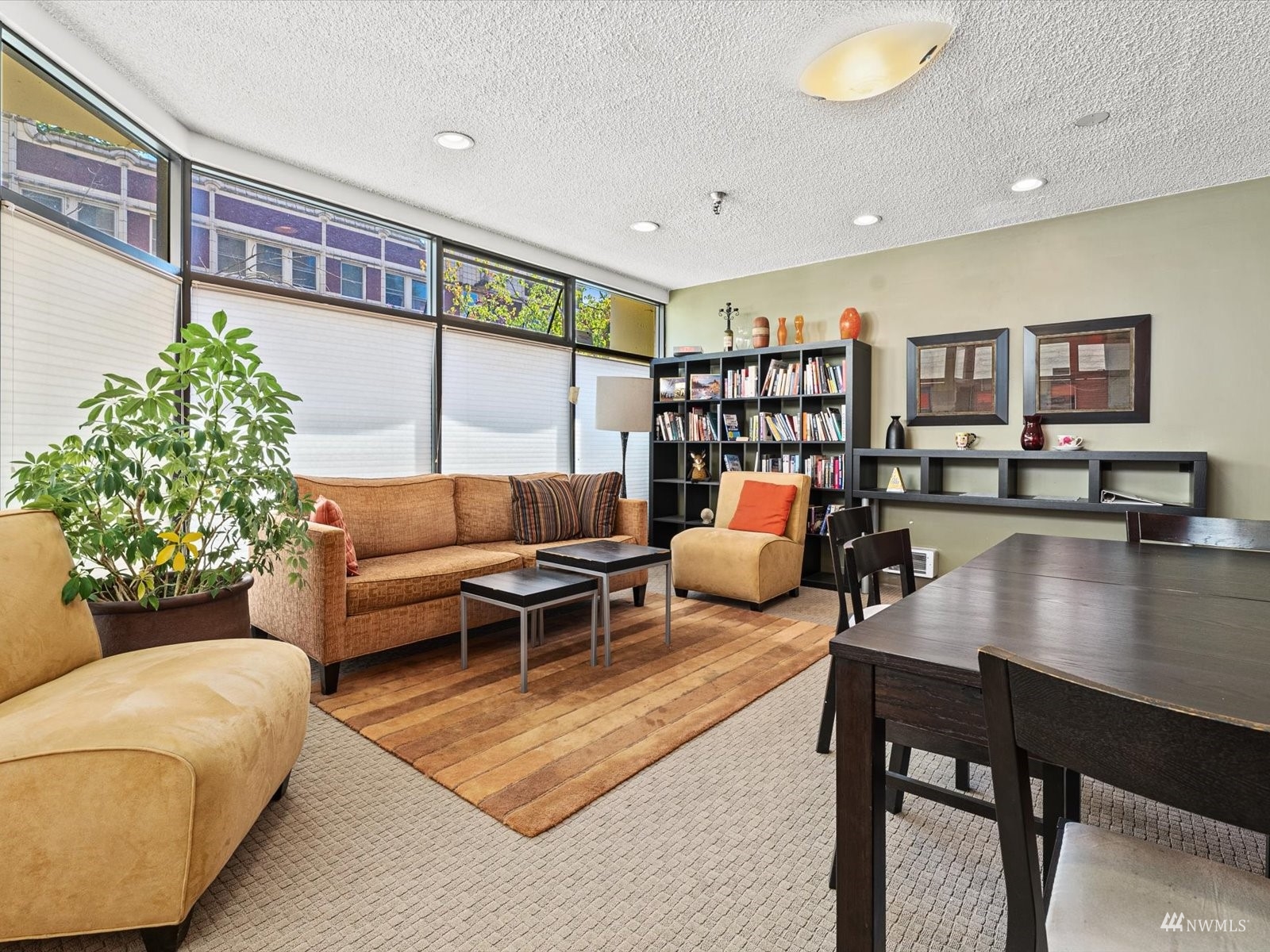 1300 University Street, Unit 2C Seattle, WA 98101 - Photo 20 of 20 a living room with furniture and book shelf