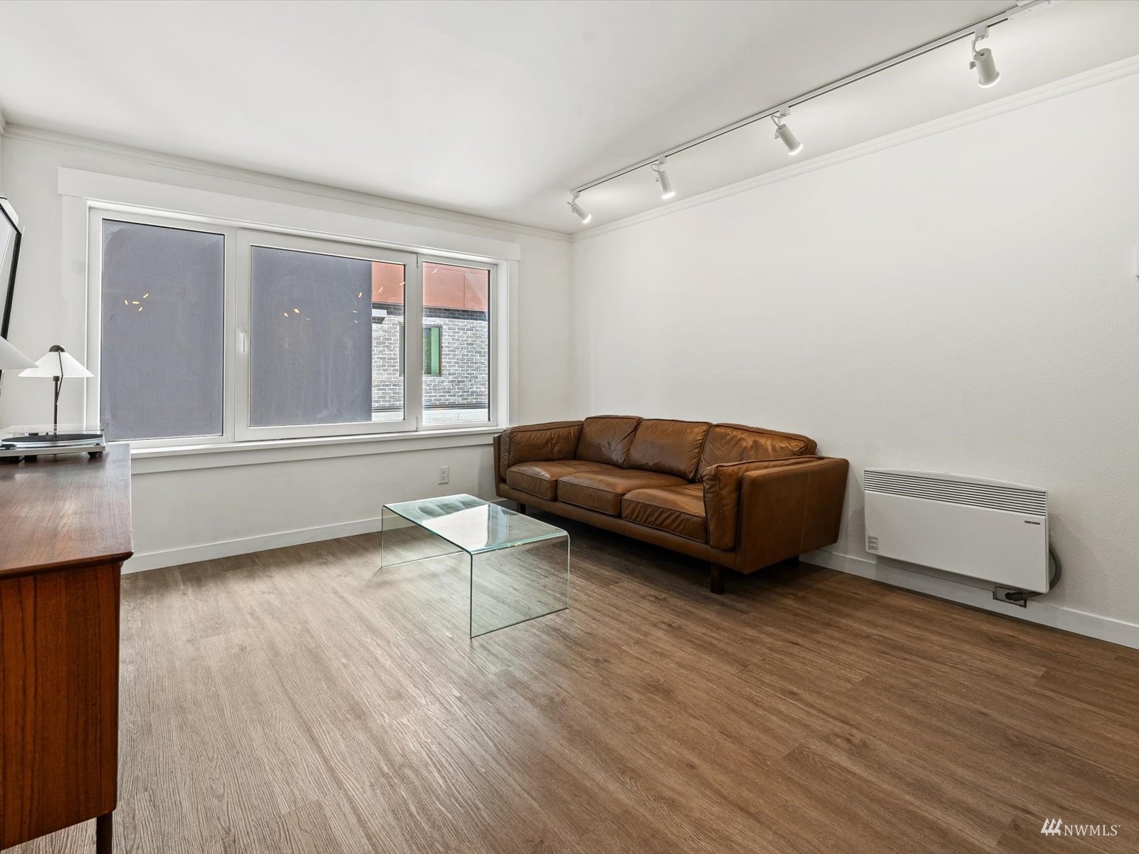 1300 University Street, Unit 2C Seattle, WA 98101 - Photo 3 of 20 a living room with furniture and a window