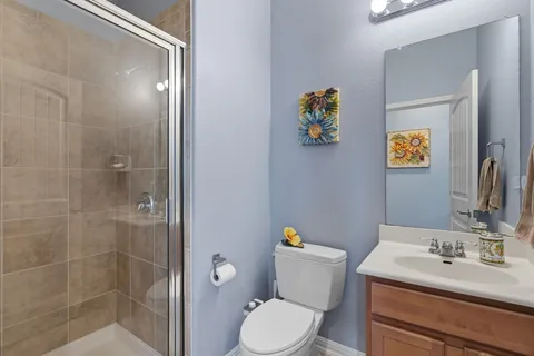a bedroom with a bed and a desk