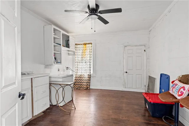 a spacious bathroom with a tub sink and mirror