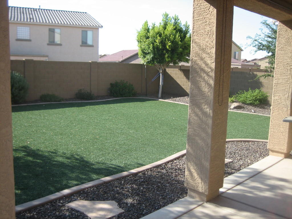 6912 West Carson Road Laveen, AZ 85339 - Photo 18 of 24 a view of a backyard with a garden