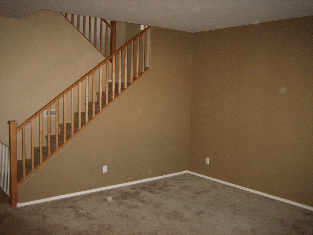 6912 West Carson Road Laveen, AZ 85339 - Photo 2 of 24 a view of an empty room with stairs