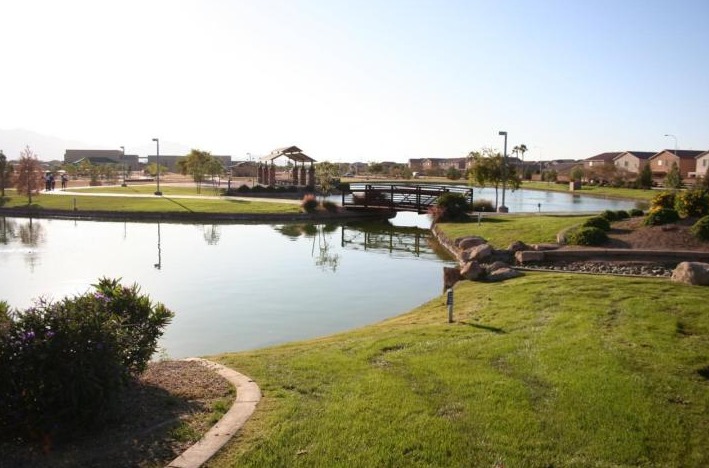 6912 West Carson Road Laveen, AZ 85339 - Photo 22 of 24 a view of a lake with houses in the back