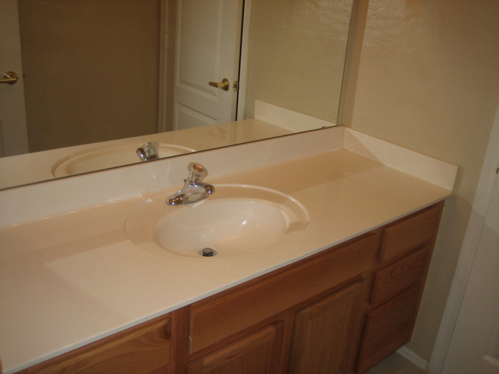 6912 West Carson Road Laveen, AZ 85339 - Photo 6 of 24 a bathroom with a sink and a mirror