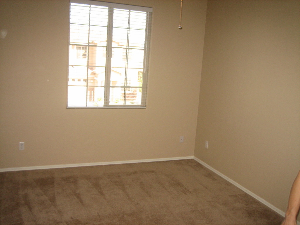6912 West Carson Road Laveen, AZ 85339 - Photo 9 of 24 an empty room with a window
