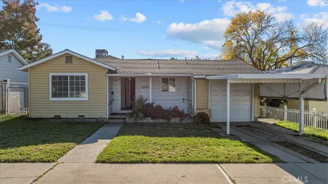 front view of a house with a yard