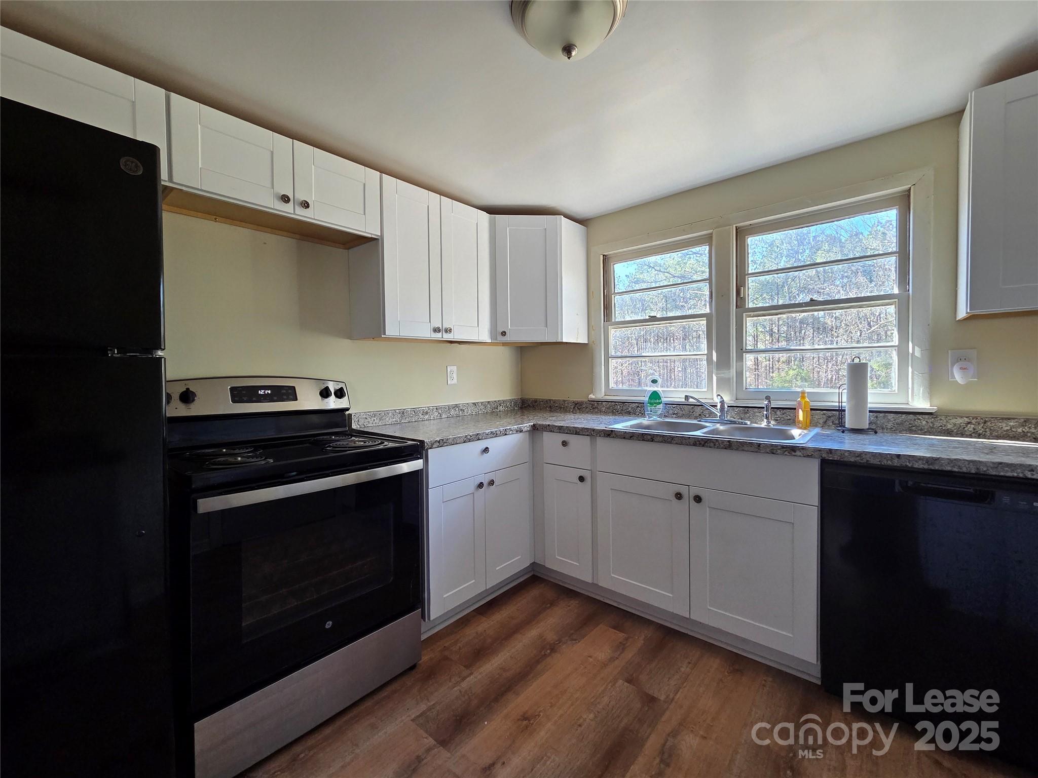 8334 Oak Tree Road Sharon, SC 29742 - Photo 6 of 15 a kitchen with stainless steel appliances granite countertop a stove a sink and a microwave