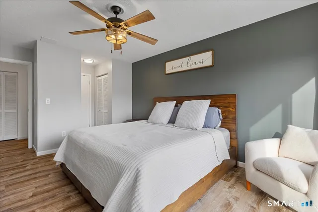 a view of a roof deck with wooden fence and floor