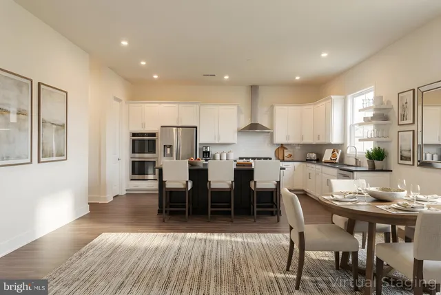 a kitchen with granite countertop a sink stove and cabinets