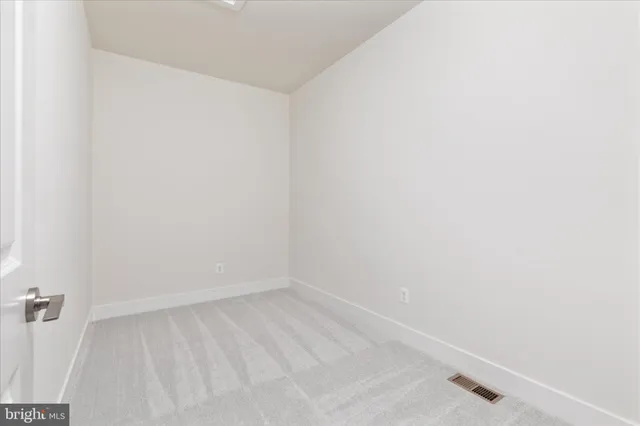 a view of a room with racks on the wall