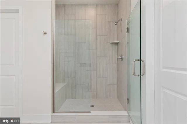 an aerial view of a house with swimming pool garden and patio