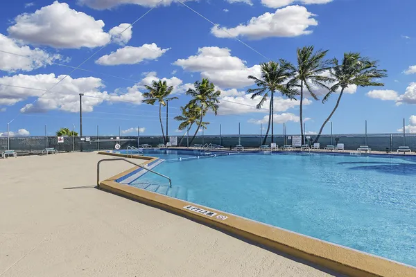 a view of swimming pool with outdoor seating