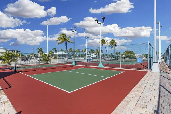 a view of a park with iron fence