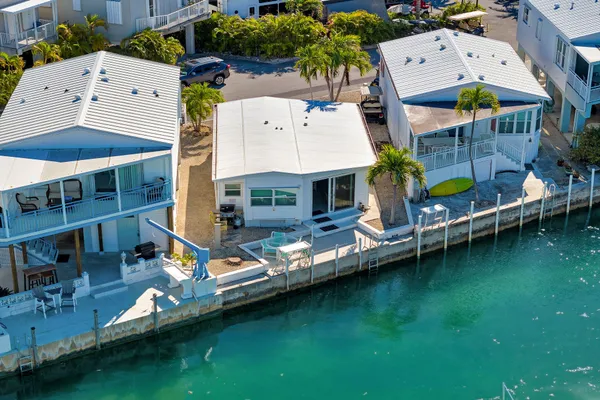 an aerial view of a house with swimming pool outdoor seating yard and outdoor seating