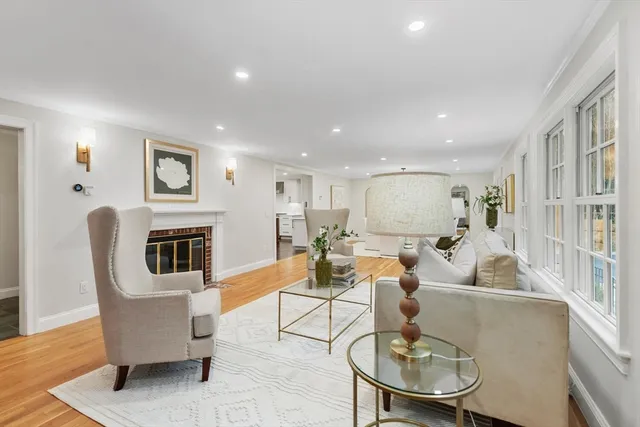 a living room with fireplace furniture dining table and a fireplace