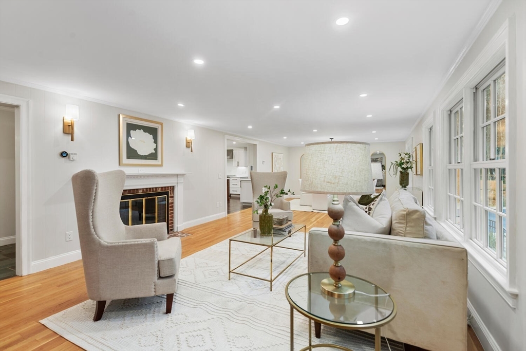 156 Cherry Brook Road Weston, MA 02493 - Photo 11 of 30 a living room with fireplace furniture dining table and a fireplace
