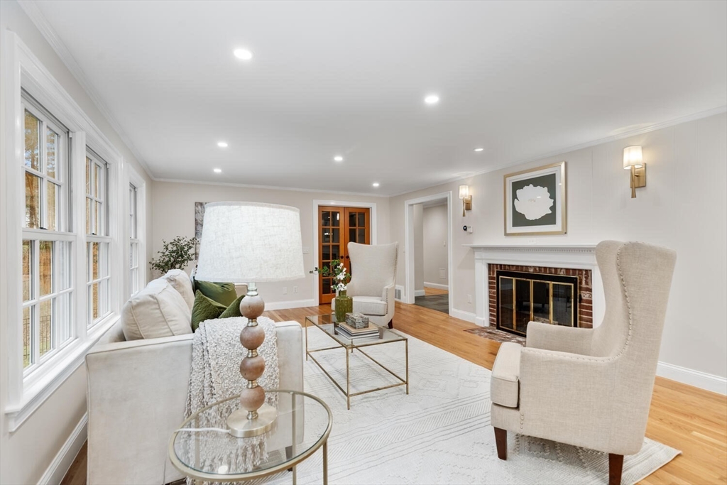 156 Cherry Brook Road Weston, MA 02493 - Photo 12 of 30 a living room with furniture a fireplace and a large window