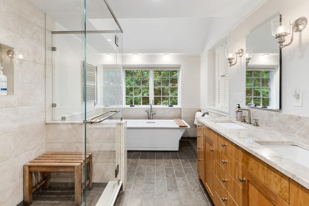 156 Cherry Brook Road Weston, MA 02493 - Photo 15 of 30 a spacious bathroom with a granite countertop tub sink and mirror