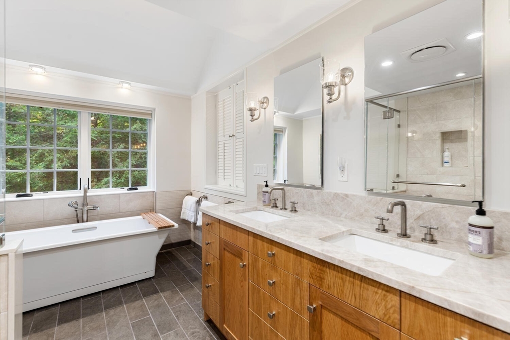 156 Cherry Brook Road Weston, MA 02493 - Photo 16 of 30 a spacious bathroom with a double vanity sink large mirror and a bathtub