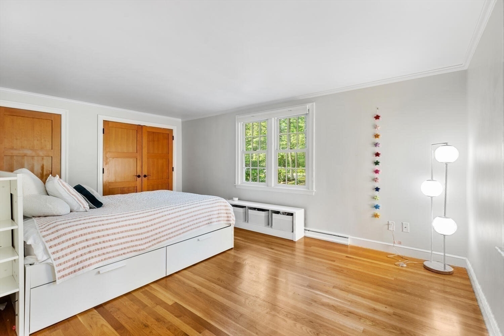 156 Cherry Brook Road Weston, MA 02493 - Photo 17 of 30 a bedroom with a bed and a window