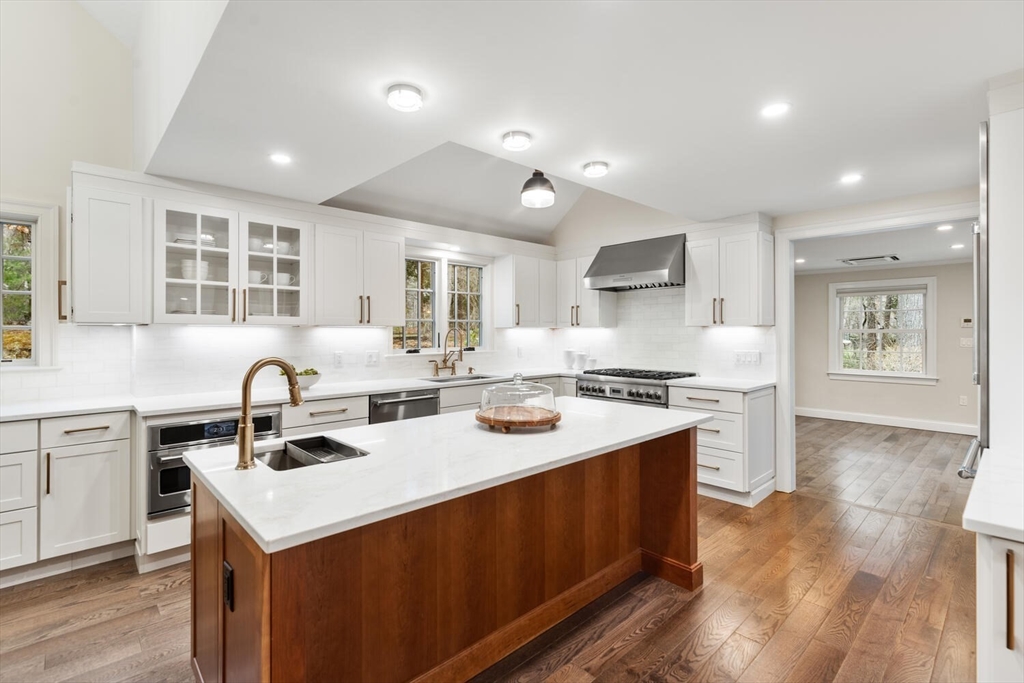 156 Cherry Brook Road Weston, MA 02493 - Photo 5 of 30 a kitchen with a sink stove cabinets and refrigerator