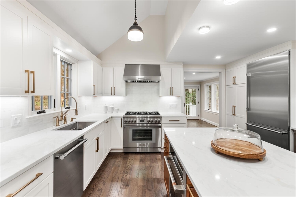156 Cherry Brook Road Weston, MA 02493 - Photo 6 of 30 a kitchen with kitchen island granite countertop a sink stainless steel appliances and cabinets