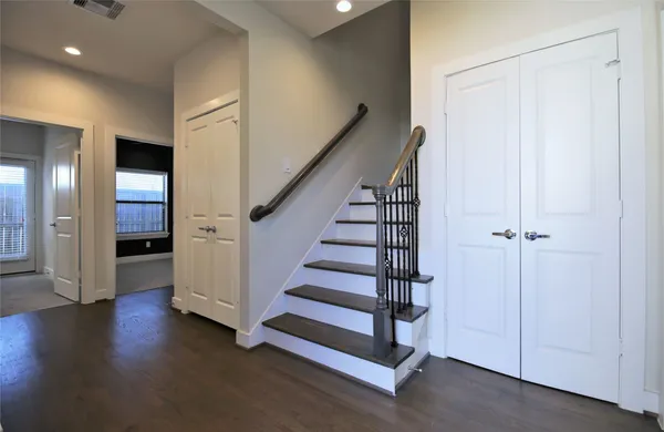 a view of entryway with wooden floor