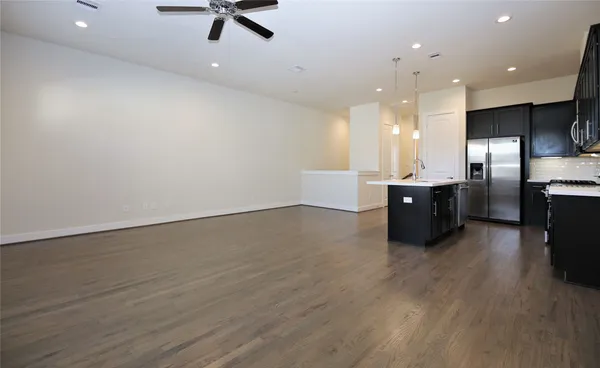 a kitchen with a sink a stove and refrigerator