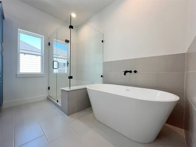 a white bath tub sitting in a bathroom
