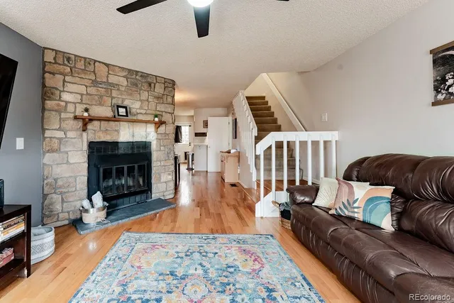 a living room with furniture and a fireplace
