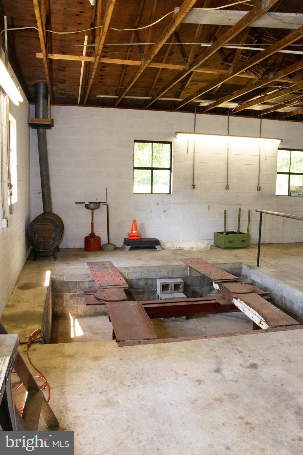 12212 Orange Plank Road Locust Grove, VA 22508 - Photo 67 of 76 Repair pit in left side of garage
