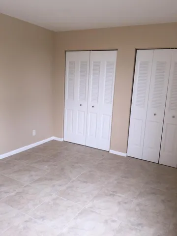 a view of an empty room and entryway