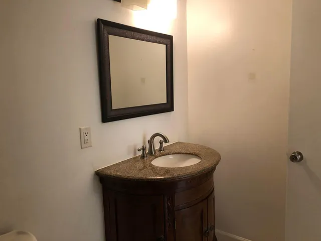 a bathroom with a tub and a toilet
