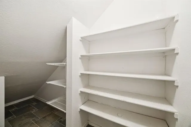 a view of empty room with a ceiling fan