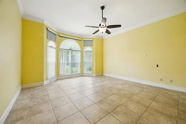 a spacious bedroom with a bed and a couch