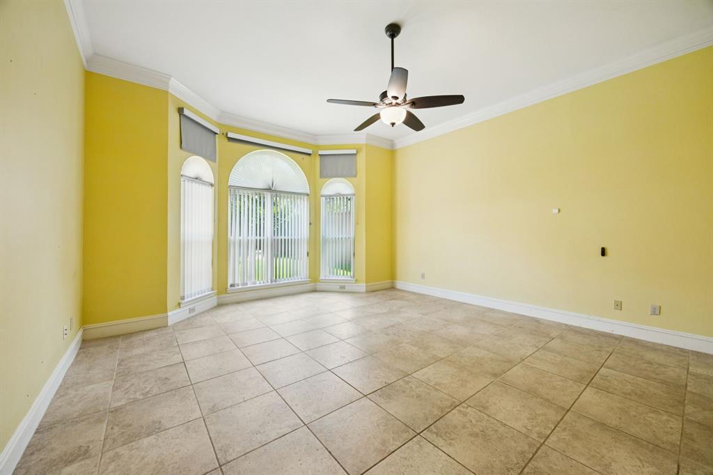 2604 Spring Lake Drive Richardson, TX 75082 - Photo 16 of 34 a view of empty room with a ceiling fan