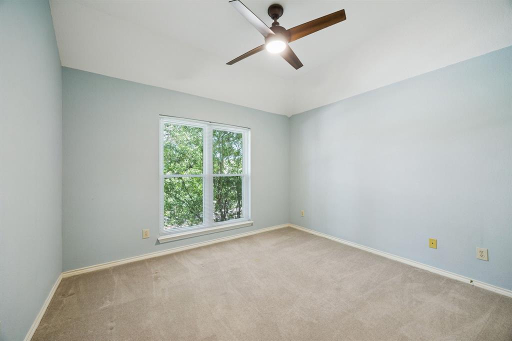 2604 Spring Lake Drive Richardson, TX 75082 - Photo 20 of 34 an empty room with a window and a fan