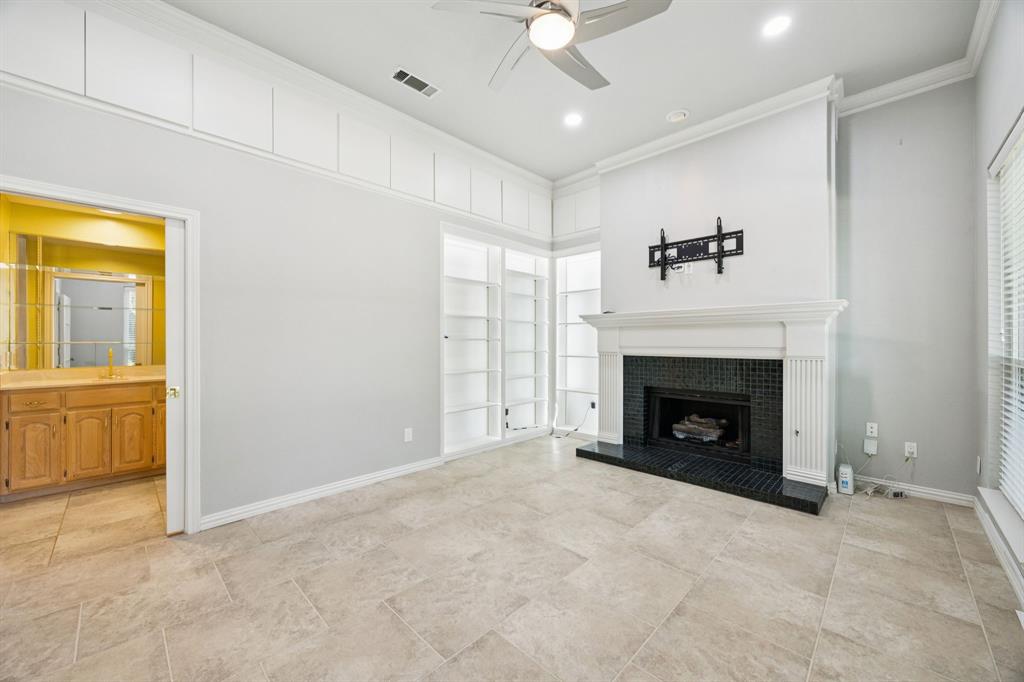 2604 Spring Lake Drive Richardson, TX 75082 - Photo 2 of 34 a view of an empty room with a fireplace and a window