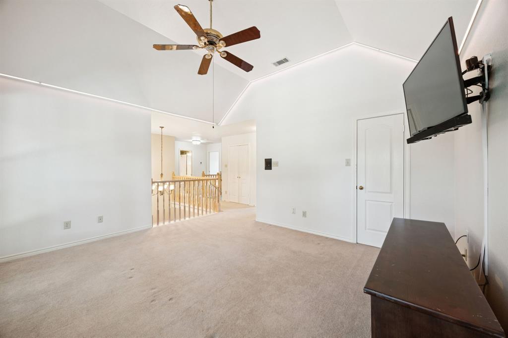2604 Spring Lake Drive Richardson, TX 75082 - Photo 26 of 34 a view of a livingroom with a ceiling fan and entryway