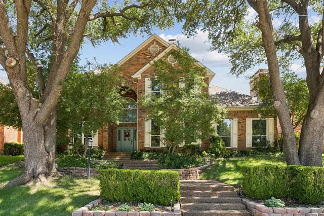 an aerial view of a house with a swimming pool yard and outdoor seating