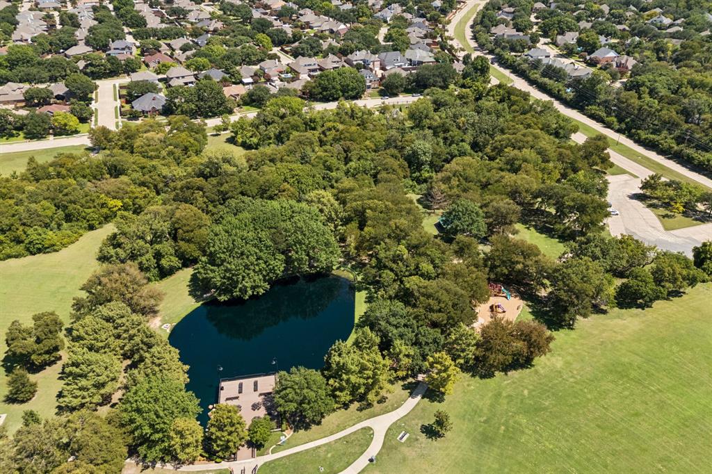 2604 Spring Lake Drive Richardson, TX 75082 - Photo 32 of 34 an aerial view of a house with a yard and lake view