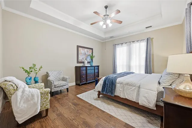 a bedroom with a bed and a couch