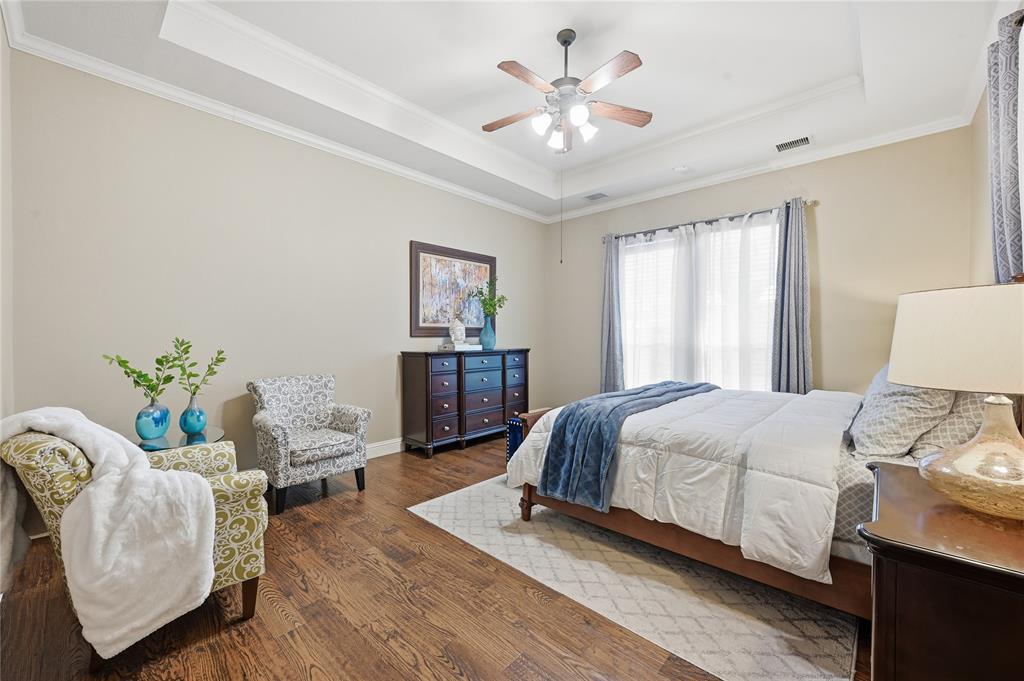 3200 Walnut Grove Place Flower Mound, TX 75022 - Photo 14 of 33 a bedroom with a bed and a couch