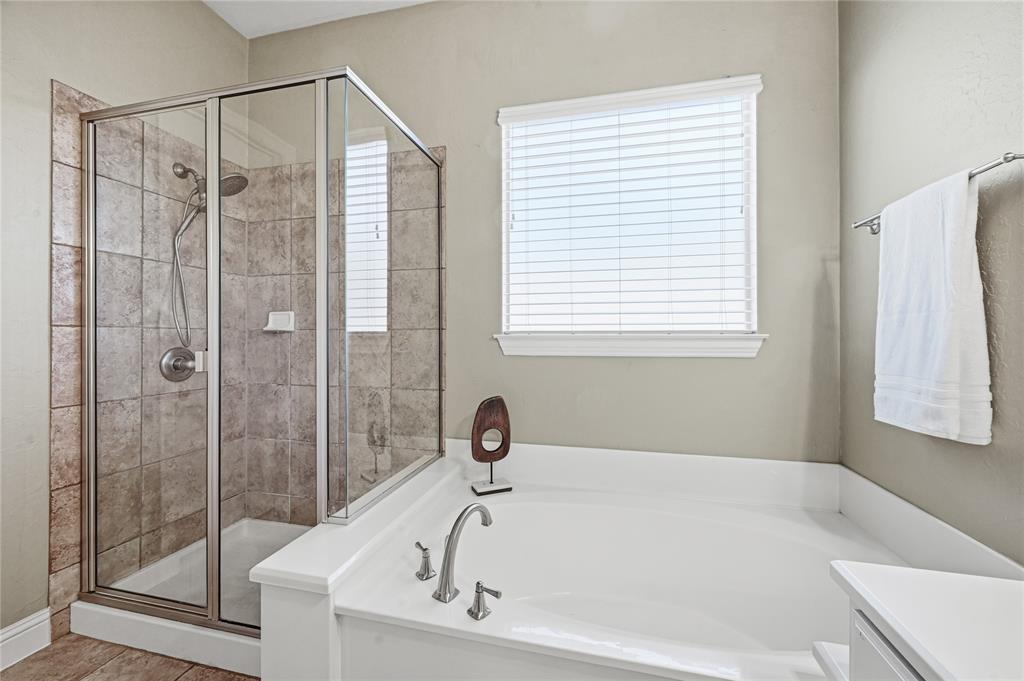 3200 Walnut Grove Place Flower Mound, TX 75022 - Photo 18 of 33 a white bath tub sitting next to a shower