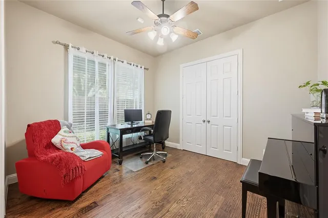 a livingroom with a couch and a window