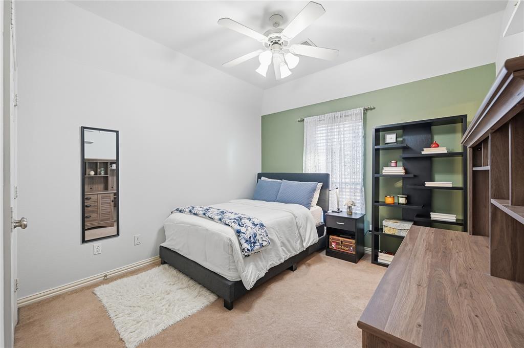 3200 Walnut Grove Place Flower Mound, TX 75022 - Photo 24 of 33 a bedroom with a bed and a book shelf