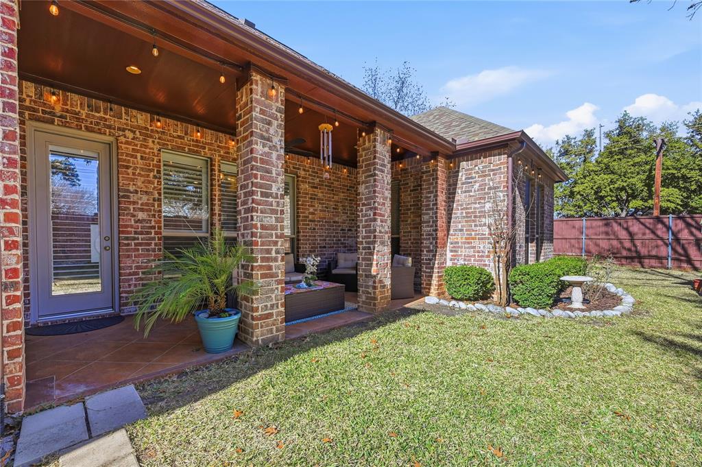 3200 Walnut Grove Place Flower Mound, TX 75022 - Photo 29 of 33 a backyard of a house with seating space
