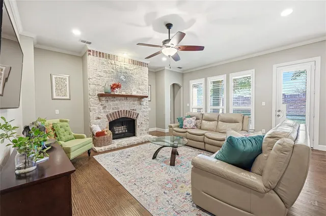 a living room with furniture and a fireplace