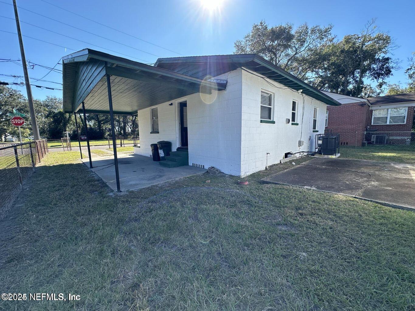 803 Crestwood Street Jacksonville, FL 32208 - Photo 13 of 14 a view of a house with backyard