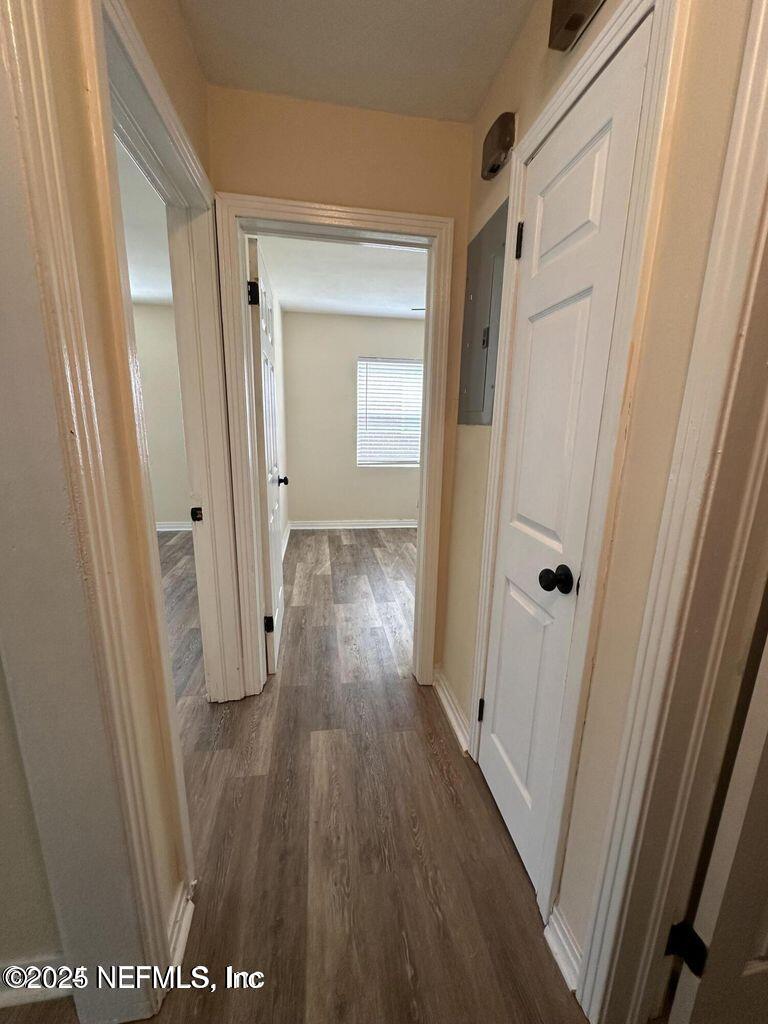 803 Crestwood Street Jacksonville, FL 32208 - Photo 8 of 14 a view of a hallway with wooden floor
